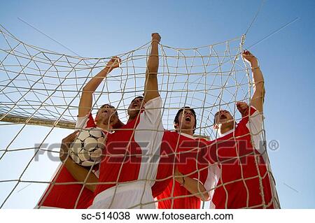 Stock Photo - Boys celebrating in Goal. Fotosearch