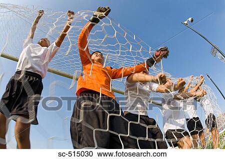 Boys grabbing the net View Large Photo Image Stock Image - Boys grabbing the net. Fotosearch