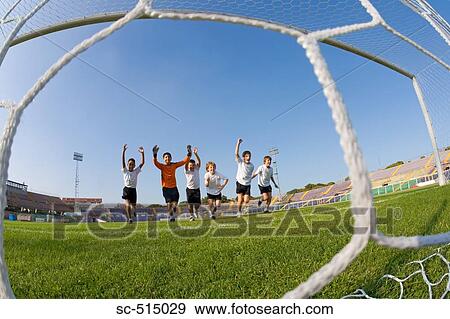 Boys running into Goal View Large Photo Image Stock Photo - Boys running into Goal. Fotosearch
