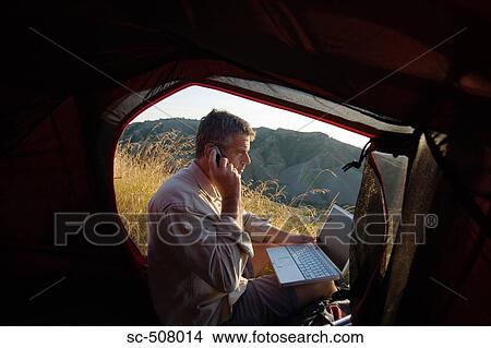 Camper with mobile and laptop View Large Photo Image Picture - Camper with mobile and laptop. Fotosearch