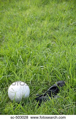 Cleats And Soccer Ball Lying In a Field View Large Photo Image Stock Photo - Cleats And Soccer Ball Lying In a Field. Fotosearch