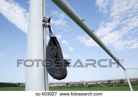 Stock Photo - Cleats Tied To a Soccer Post. Fotosearch