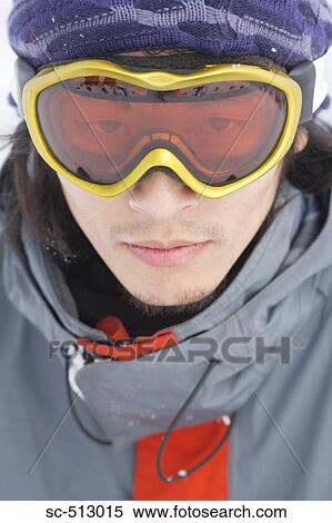 Stock Photography - Close up of male Asian snowboarder. Fotosearch