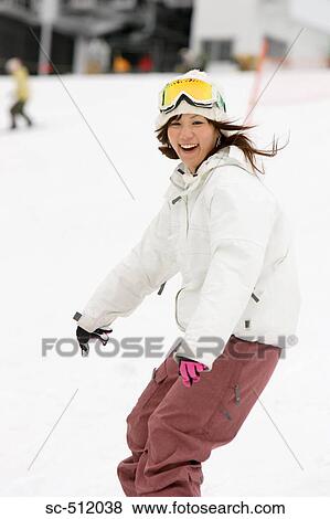 Stock Photo - Cute young Asian snowboarder. Fotosearch