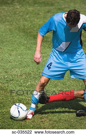 Stock Image - Dangerous tackle. Fotosearch