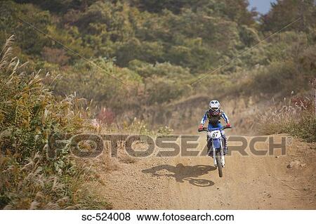 Dirtbiking over Mounds View Large Photo Image Stock Photo - Dirtbiking over Mounds. Fotosearch