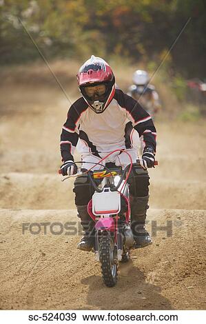 Dirtbiking over Mounds View Large Photo Image Stock Photo - Dirtbiking over Mounds. Fotosearch