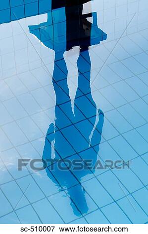 Stock Photo - Diver reflected in swimming pool. Fotosearch