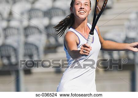 Female tennis player reaching to volley View Large Photo Image Picture - Female tennis player reaching to volley. Fotosearch