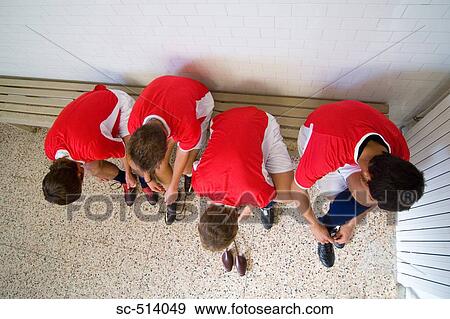 Stock Photo - Four boys in a changing room. Fotosearch