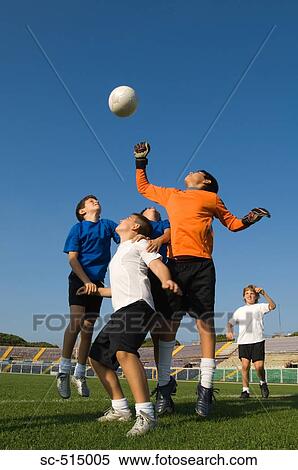 Goal keeper punching the ball away View Large Photo Image Stock Photography - Goal keeper punching the ball away. Fotosearch