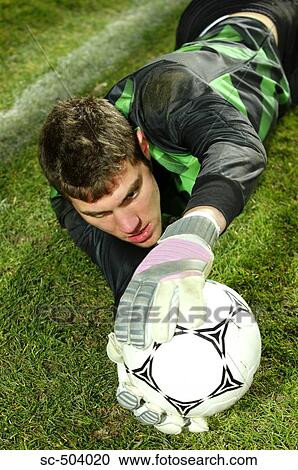 Stock Image - Goalie Making A Save. Fotosearch