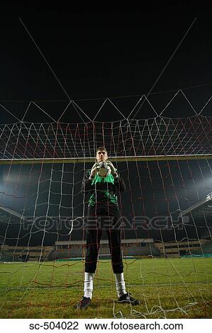 Stock Image - Goalkeeper Holding a Soccer Ball. Fotosearch