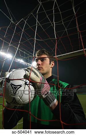 Stock Image - Goalkeeper Holding a Soccer Ball. Fotosearch