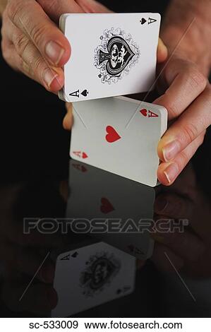 Hands shuffling deck of playing cards View Large Photo Image Stock Photo - Hands shuffling deck of playing cards. Fotosearch