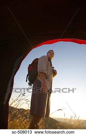 Hiker viewed from tent View Large Photo Image Stock Image - Hiker viewed from tent. Fotosearch