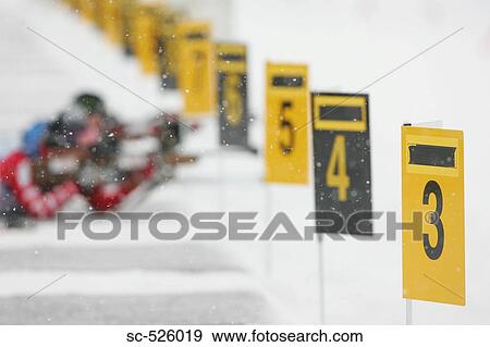 Stock Photo - Ice skating poles for ice skating in snow. Fotosearch