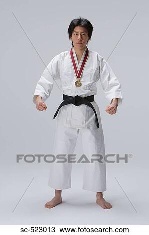 Stock Image - Judo-ka with Medal. Fotosearch