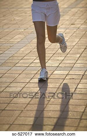 Legs of Teenage Jogger View Large Photo Image Stock Photo - Legs of Teenage Jogger. Fotosearch