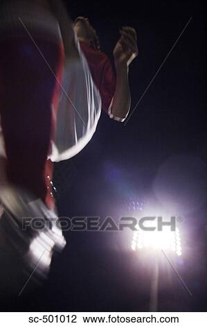 Low Angle View of Running Soccer Player View Large Photo Image Stock Image - Low Angle View of Running Soccer Player. Fotosearch
