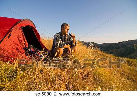 Male camper with binoculars View Large Photo Image Stock Image - Male camper with binoculars. Fotosearch