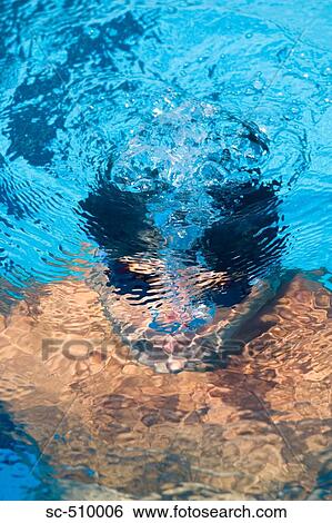 Male swimmer under water View Large Photo Image Stock Photograph - Male swimmer under water. Fotosearch