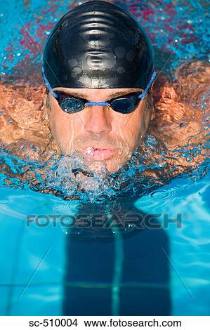 Male swimmer with cap and goggles View Large Photo Image Picture - Male swimmer with cap and goggles. Fotosearch