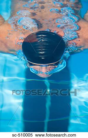 Stock Photography - Male swimmer with swim cap. Fotosearch