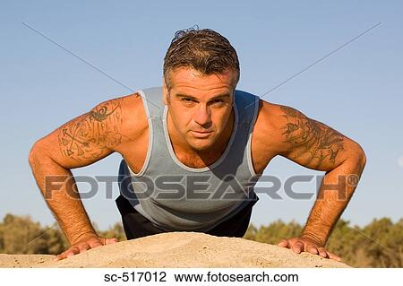 Stock Image - Man Doing Push Ups. Fotosearch