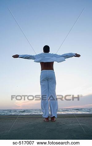 Man Enjoying the Coastal Wind View Large Photo Image Stock Photo - Man Enjoying the Coastal Wind. Fotosearch