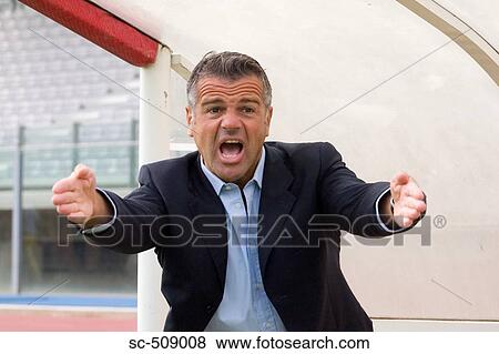 Stock Photo - Man in suit looking frustrated. Fotosearch