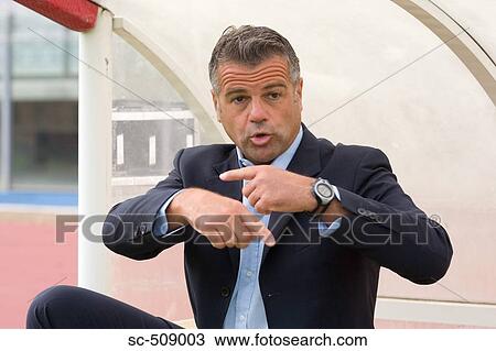 Man in suit signaling View Large Photo Image Stock Image - Man in suit signaling. Fotosearch