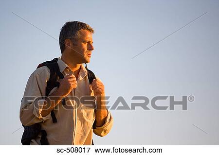Man with backpack View Large Photo Image Stock Photo - Man with backpack. Fotosearch