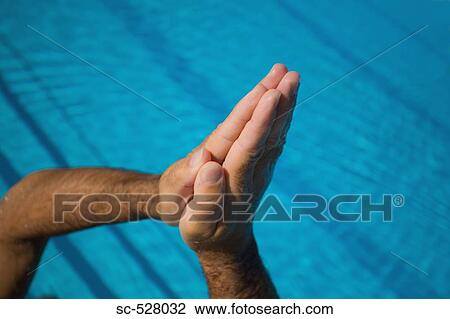 Stock Image - Man with hands clasp. Fotosearch