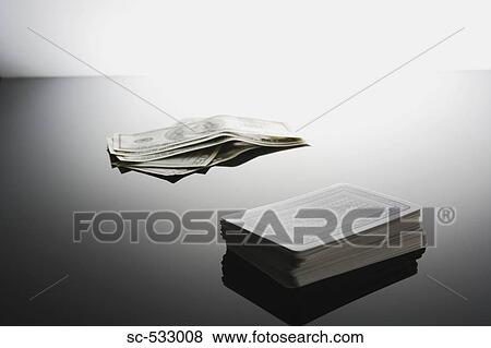 Money and deck of cards on table View Large Photo Image Stock Photo - Money and deck of cards on table. Fotosearch