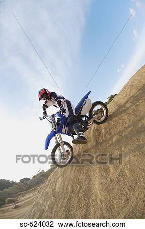 Stock Image - Motocross Rider Turning. Fotosearch