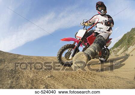 Stock Image - Motocross Rider Turning. Fotosearch