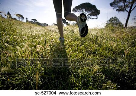 Person jogging in countryside View Large Photo Image Picture - Person jogging in countryside. Fotosearch
