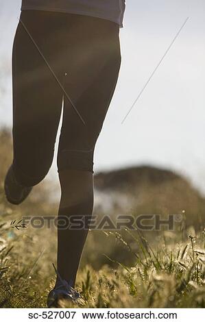 Person jogging in countryside View Large Photo Image Stock Photo - Person jogging in countryside. Fotosearch