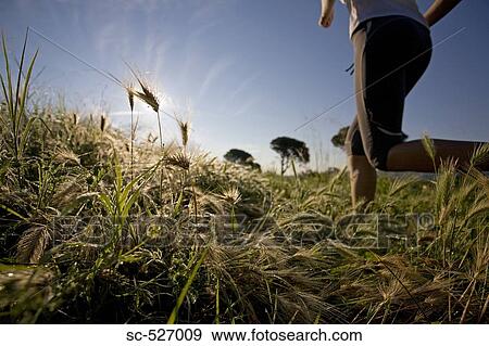 Stock Photo - Person jogging in countryside. Fotosearch