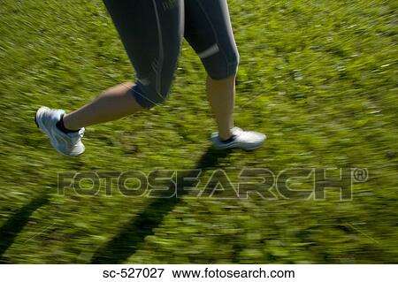 Person jogging in countryside View Large Photo Image Stock Photo - Person jogging in countryside. Fotosearch