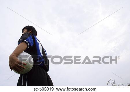 Stock Photo - Portrait of a Young Soccer Player. Fotosearch