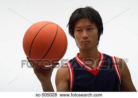 Stock Photo - Portrait of an Asian Basketball Player. Fotosearch