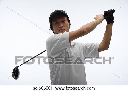 Stock Image - Portrait of Asian Golf Player. Fotosearch