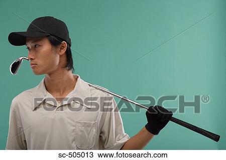Stock Image - Portrait of Asian Golf Player. Fotosearch