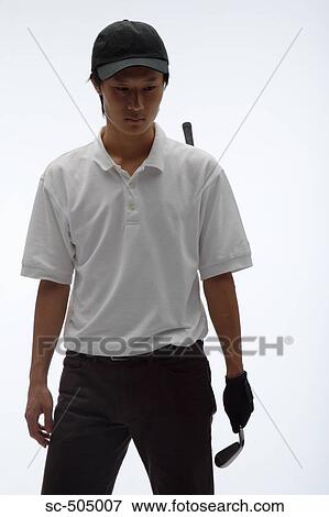 Stock Photo - Portrait of Asian Golf Player. Fotosearch