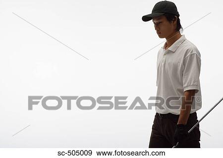 Stock Photo - Portrait of Asian Golf Player. Fotosearch