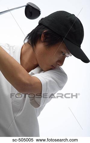 Stock Photography - Portrait of Asian Golf Player. Fotosearch