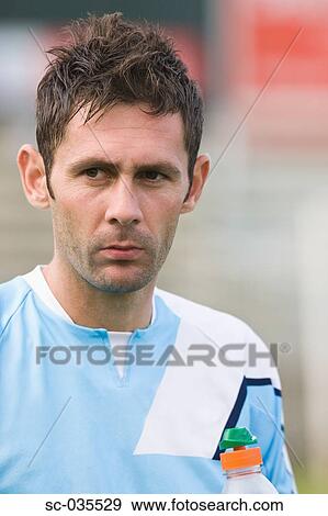Stock Photo - Portrait of soccer player. Fotosearch