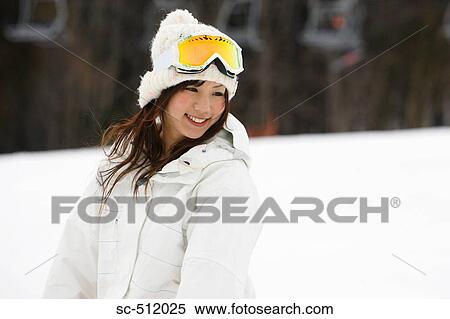Pretty young Asian snowboarder View Large Photo Image Stock Photography - Pretty young Asian snowboarder. Fotosearch